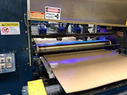 Three sensors on a linear belt slide system read the moisture levels and coating thickness of corrugated sheets. MoistTech is introducing the system to the plastics and converting industries this summer. Three sensors on a linear belt slide system read the moisture levels and coating thickness of corrugated sheets. MoistTech is introducing the system to the plastics and converting industries this summer.