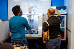Two men work at a milling machine supplied by Tormach Inc. to Limbitless Solutions. Two men work at a milling machine supplied by Tormach Inc. to Limbitless Solutions.