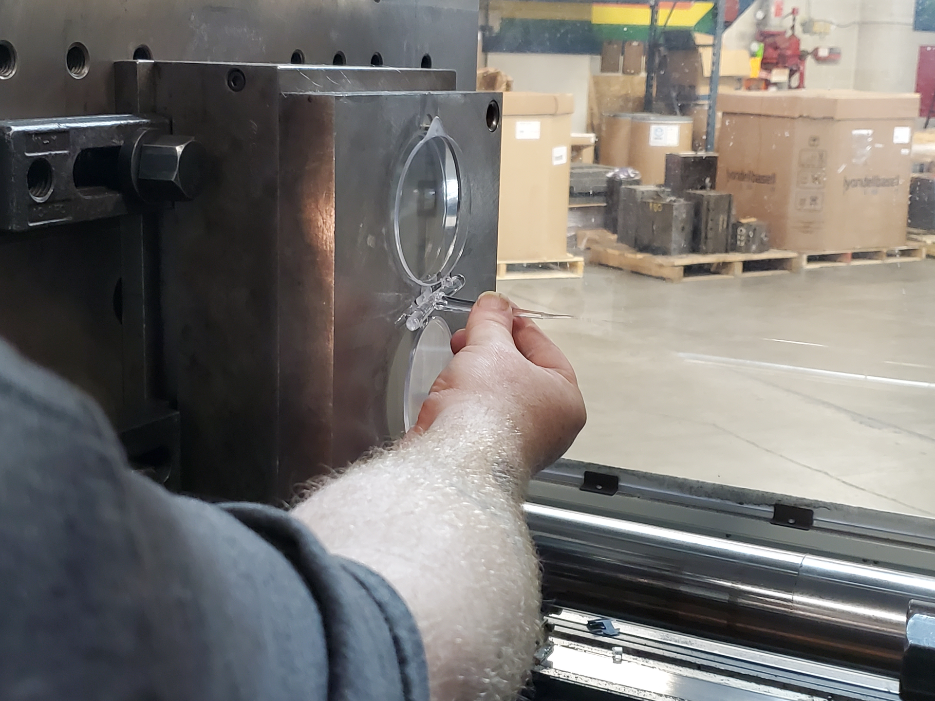 A member of American Mask Manufacturer's Association, Dentec Safety Specialists Inc. so far has weathered the eroding market for masks, in part because it has a diversified product portfolio. Here, a worker helps produce a lens for a surgical microscope.