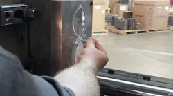 A member of American Mask Manufacturer's Association, Dentec Safety Specialists Inc. so far has weathered the eroding market for masks, in part because it has a diversified product portfolio. Here, a worker helps produce a lens for a surgical microscope.