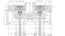 The invention’s spacer and guide assembly is designed to compensate for the differing thermal expansions of the hot manifold and the cooler control plate; this prevents the pin from experiencing damaging stresses.