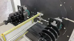 With the new feature, the coiler is programmed to wind one spool at a time until all the spools on one shaft are full. Then the coiler moves the shaft with empty spools into position.