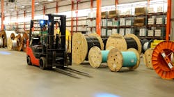 A forklift truck operates inside Corning&apos;s Hickory, N.C., plant, where the company is relying on a 5G network to create the fiber optic cable that carries 5G signals to others.