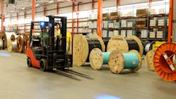 A forklift truck operates inside Corning's Hickory, N.C., plant, where the company is relying on a 5G network to create the fiber optic cable that carries 5G signals to others. A forklift truck operates inside Corning's Hickory, N.C., plant, where the company is relying on a 5G network to create the fiber optic cable that carries 5G signals to others.