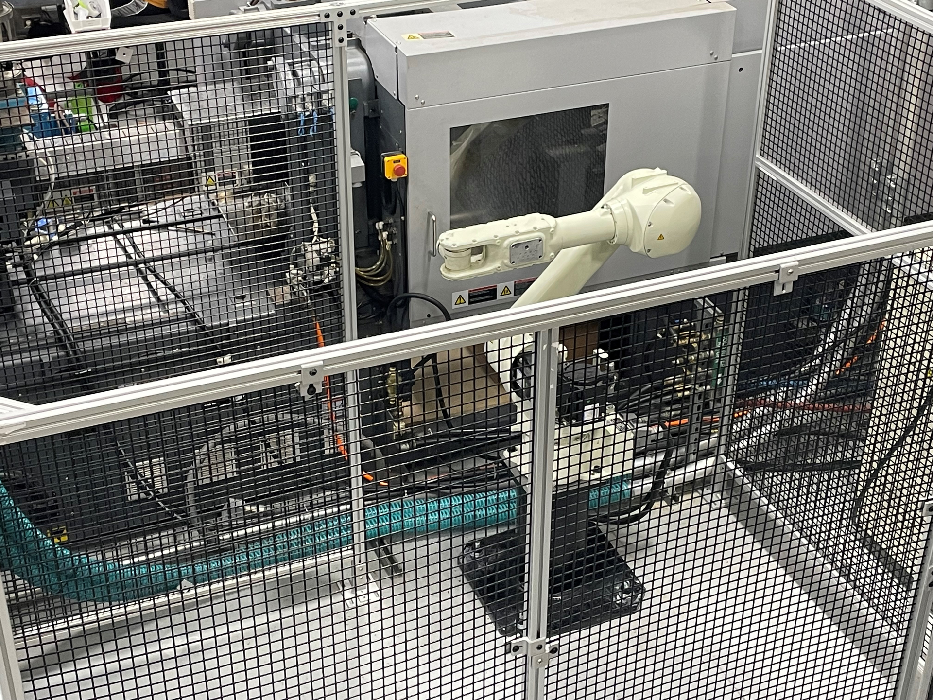 Champion Plastics added this Kawasaki RS010N A six-axis robot to tend an injection molding machine.