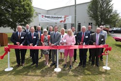 James Murphy, third from left, prepares to cut a ribbon at Davis-Standard's die-cell center addition in July 2017. James Murphy, third from left, prepares to cut a ribbon at Davis-Standard's die-cell center addition in July 2017.