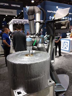 At Automate 2022, Kolinahr's Robot Label Applicator was paired with a UR10e cobot to place a label on the inside of a roll core. At Automate 2022, Kolinahr's Robot Label Applicator was paired with a UR10e cobot to place a label on the inside of a roll core.