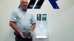 Rick Finnie poses with his award as American Mold Builders Association&apos;s 2019 Mold Builder of the Year.
