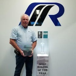 Rick Finnie poses with his award as American Mold Builders Association&apos;s 2019 Mold Builder of the Year.