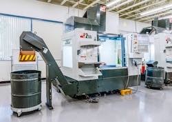 Haas Automation's dual-auger conveyor prevents chip buildup in VMCs. Haas Automation's dual-auger conveyor prevents chip buildup in VMCs.