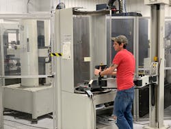 A Pyramid Molding Group employee works at a machine. A Pyramid Molding Group employee works at a machine.