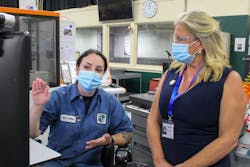 Machinist Victoria Rooke talks to a visitor at Westminster Tool. Machinist Victoria Rooke talks to a visitor at Westminster Tool.