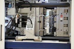 A StackTeck 96-cavity PET preform mold is shown in a Netstal PET-Line 4000 system. A StackTeck 96-cavity PET preform mold is shown in a Netstal PET-Line 4000 system.