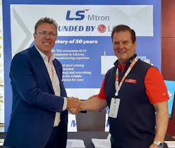 Peter Gardner, business director of LS Mtron Injection Molding Machines North America, left, poses with Mark Padgett, president of Millholland Conrad, Inc.