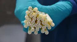 Tubing for a new blood-separation device required intricate tooling to produce one tiny center hole surrounded by four larger holes.