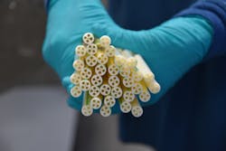 Tubing for a new blood-separation device required intricate tooling to produce one tiny center hole surrounded by four larger holes. Tubing for a new blood-separation device required intricate tooling to produce one tiny center hole surrounded by four larger holes.