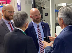 Matt Seaholm (center), PLASTICS president and CEO, and Patrick Krieger (left), VP of sustainability, attend a K Show event produced by PLASTICS member KraussMaffei.
