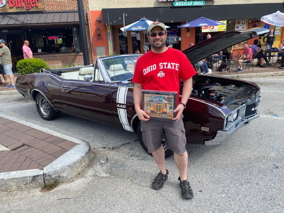 Umberto Catignani enjoys going to car shows. Here, he shows off an award recognizing his 1968 Oldsmobile 442 as one of the 16 best entries at a show.