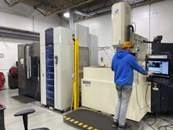An employee works at an electrical discharge machining cell at Decatur Mold Tool &amp; Engineering Inc., which is expanding in the hopes that the addition of automation can make it more globally competitive.