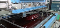 The Ultra-Wide TOM Machine from Japanese equipment manufacturer Fu-se Vacuum Forming Co. Ltd. provides an automated method for applying Aero films to large parts, such as body panels. The Ultra-Wide TOM Machine from Japanese equipment manufacturer Fu-se Vacuum Forming Co. Ltd. provides an automated method for applying Aero films to large parts, such as body panels.