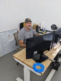 Justin Slaughter works at his desk at Merit3D. The former draftsman/surveyor has retooled his skills in recent years to become an engineering technician for 3D printing firm Merit3D. Justin Slaughter works at his desk at Merit3D. The former draftsman/surveyor has retooled his skills in recent years to become an engineering technician for 3D printing firm Merit3D.