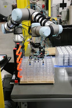A UR5e cobot from Universal Robots picks up an empty tray at the Aim Processing plant. A UR5e cobot from Universal Robots picks up an empty tray at the Aim Processing plant.