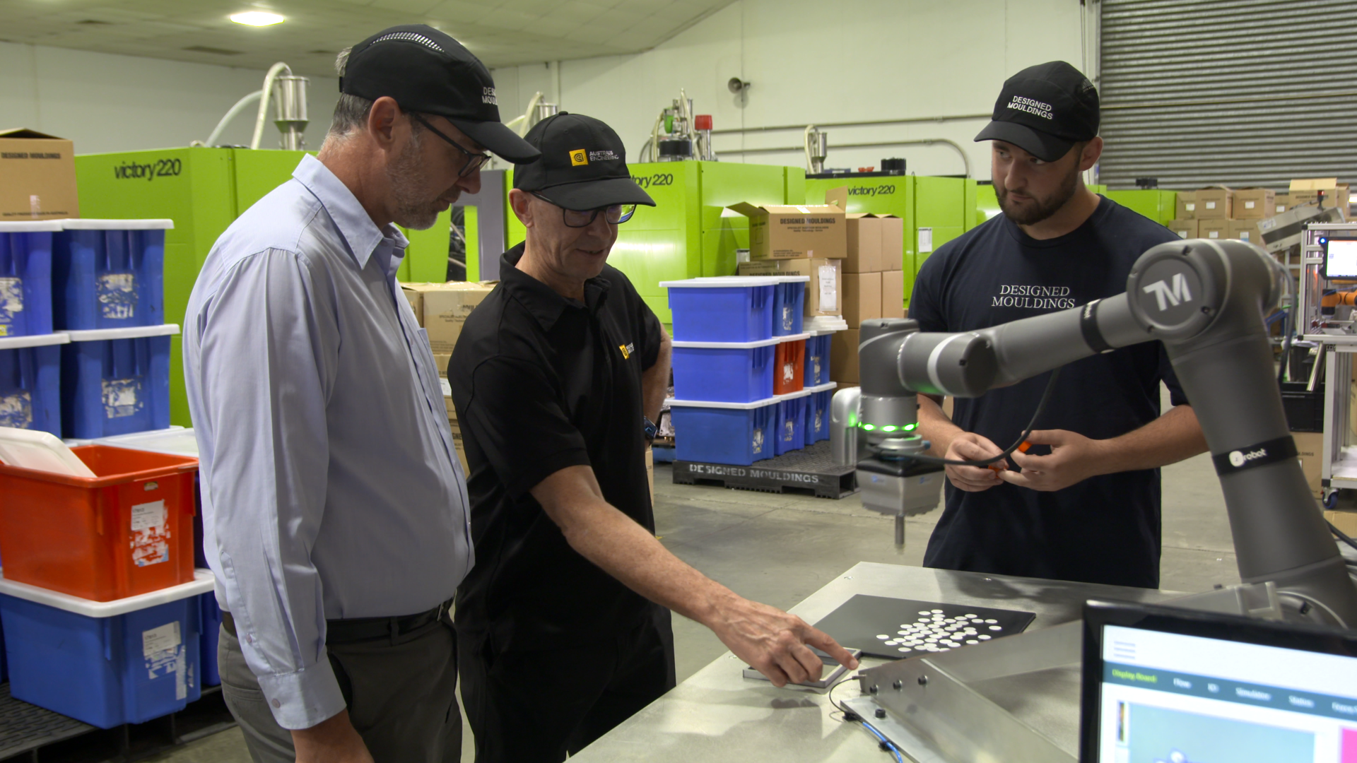 A cobot fromTechman Robot, Taoyuan, Taiwan, with an end gripper supplied by OnRobot works within reach of people at Designed Mouldings, Taren Point, Australia.