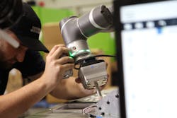 An employee works directly with a cobot from Techman Robot, Taoyuan, Taiwan. At the end of the cobot's arm is an end gripper supplied by OnRobot for use in a packaging cell at Designed Mouldings, Taren Point, Australia. An employee works directly with a cobot from Techman Robot, Taoyuan, Taiwan. At the end of the cobot's arm is an end gripper supplied by OnRobot for use in a packaging cell at Designed Mouldings, Taren Point, Australia.