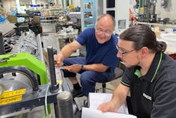 A trainer, left, works with an Engel apprentice. A trainer, left, works with an Engel apprentice.