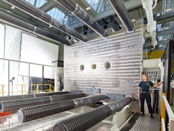 An employee works on one of the new injection molding lines installed at Infiltrator Water Technologies in Winchester, Ky. An employee works on one of the new injection molding lines installed at Infiltrator Water Technologies in Winchester, Ky.