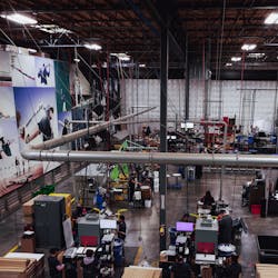 Employees work with a stable of horizontal plastic injection molding machines, along with other equipment, to produce baseball and softball bats at the Hillsboro, Ore., plant of DeMarini, a Wilson Sporting Goods brand. Employees work with a stable of horizontal plastic injection molding machines, along with other equipment, to produce baseball and softball bats at the Hillsboro, Ore., plant of DeMarini, a Wilson Sporting Goods brand.