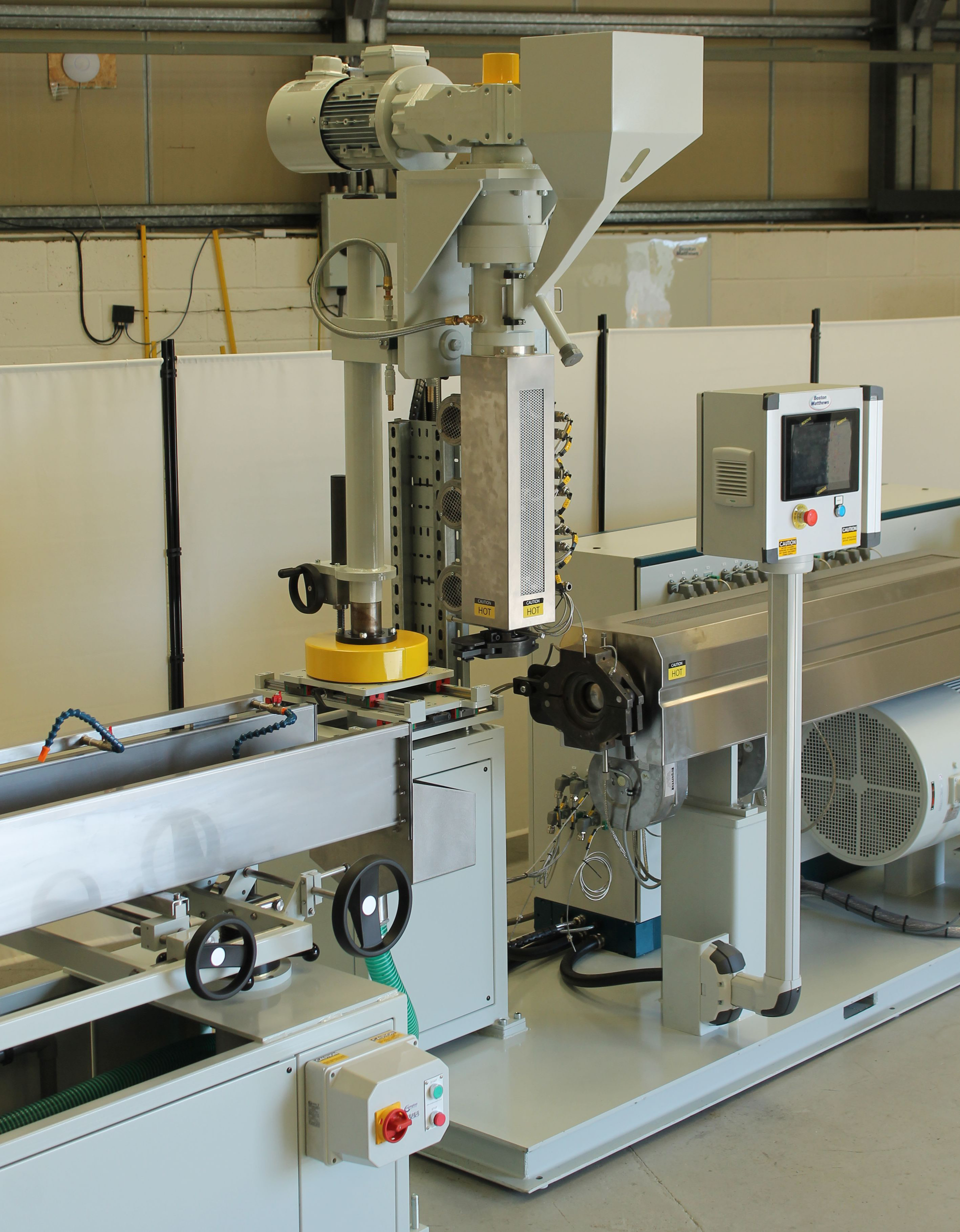 Boston Matthews&rsquo; new Compact Single Base co-extrusion solution is shown with a 75mm main single-screw extruder and a 30mm vertical jockey co-extruder.