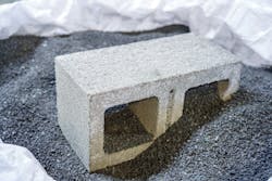Resin8, in addition to repurposing waste plastic, also weighs less than traditional aggregate material. This concrete block contains 5 percent Resin8.
