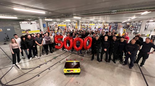 Employees gather to celebrate the manufacture of Kivnon&apos;s 5,000th autonomous mobile robot.