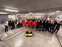 Employees gather to celebrate the manufacture of Kivnon's 5,000th autonomous mobile robot. Employees gather to celebrate the manufacture of Kivnon's 5,000th autonomous mobile robot.