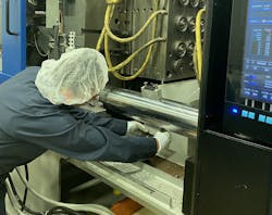 Rieke maintenance technician Ashley Williams works with Gefran QE2008-W sensors on an injection molding machine. Rieke maintenance technician Ashley Williams works with Gefran QE2008-W sensors on an injection molding machine.
