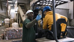 Lead tech Tommy Phillips talks to a colleague at Placon in Madison, Wis., which is among the recycling facilities spotlighted in a series of videos produced by the Plastics Industry Association showcasing the benefits of recycling.