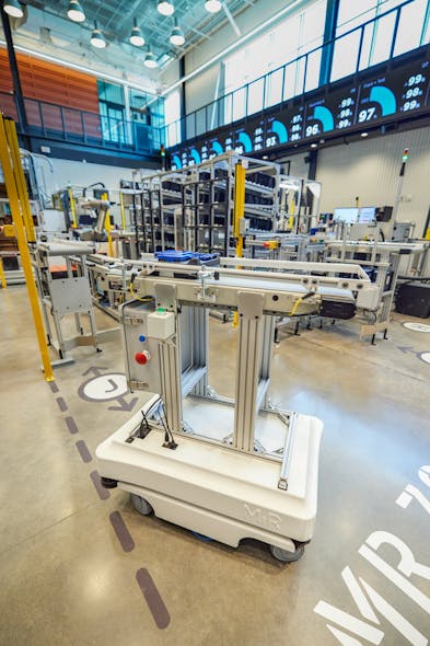 An autonomous conveyor robot delivers a product to the assembly station at the Smart Factory by Deloitte @ Wichita&rsquo;s at Wichita State University. Among other technologies, the model plant showcases the potential of AI for manufacturers.