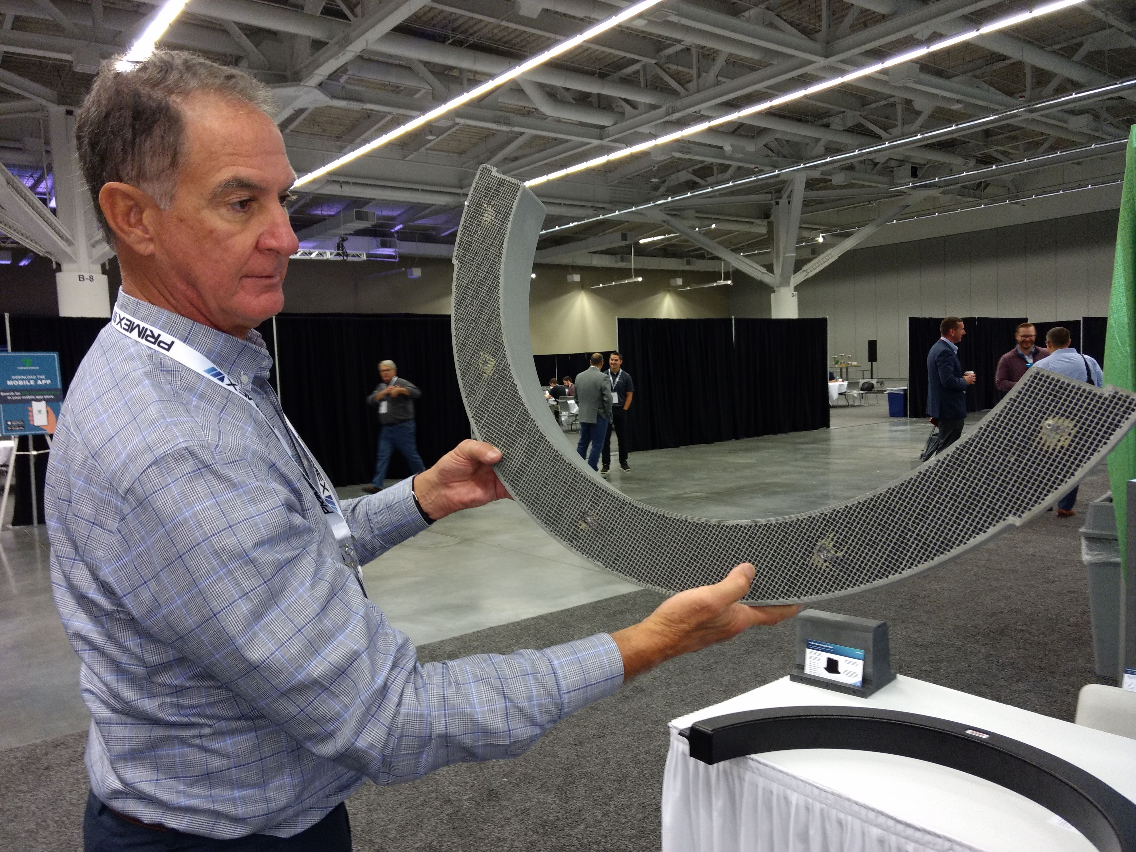 Brad Mount, global director of business development for Titan, 3D Systems, shows off a 3D printed thermoforming mold in October at the SPE Thermoforming Conference in Cleveland.