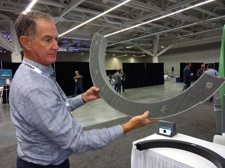 Brad Mount, global director of business development for Titan, 3D Systems, shows off a 3D printed thermoforming mold in October at the SPE Thermoforming Conference in Cleveland.
