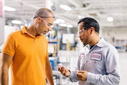 Lead molding foreman Daniel Torres, right, talks with product manager John Strubulis at Hoffer Plastics, a company that’s committed to employee advancement. Lead molding foreman Daniel Torres, right, talks with product manager John Strubulis at Hoffer Plastics, a company that’s committed to employee advancement.