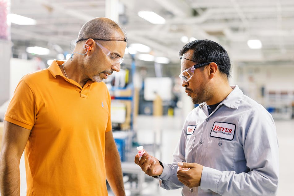 Lead molding foreman Daniel Torres, right, talks with product manager John Strubulis at Hoffer Plastics, a company that&rsquo;s committed to employee advancement.