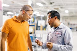 Lead molding foreman Daniel Torres, right, talks with product manager John Strubulis at Hoffer Plastics, a company that’s committed to employee advancement. Lead molding foreman Daniel Torres, right, talks with product manager John Strubulis at Hoffer Plastics, a company that’s committed to employee advancement.
