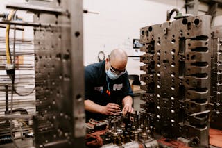 In addition to injection molding, Hoffer Plastics offers tool making services to its customers, with three onsite toolrooms and 25 toolmakers. Here, mold repair technician Mark Bargehr works at the South Elgin, Ill., company.
