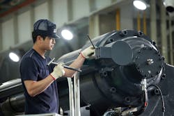 Workers build an injection molding machine at LS Mtron's factory in South Korea. Workers build an injection molding machine at LS Mtron's factory in South Korea.