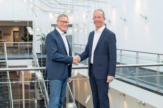 Nicolas Beyl (right) is new managing director/CTO at Br&uuml;ckner Maschinenbau, replacing Michael Baumeister (left).