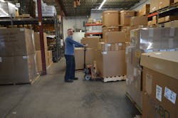 Warehouse manager Malcolm Osborne prepares to ship out a batch of fresh injection molded parts Warehouse manager Malcolm Osborne prepares to ship out a batch of fresh injection molded parts