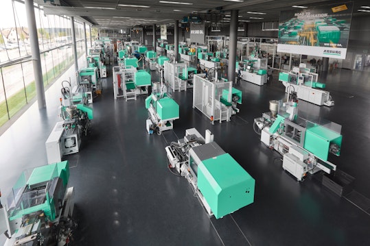 Injection molding machines are on display in Arburg's Lossburg, Germany, headquarters.