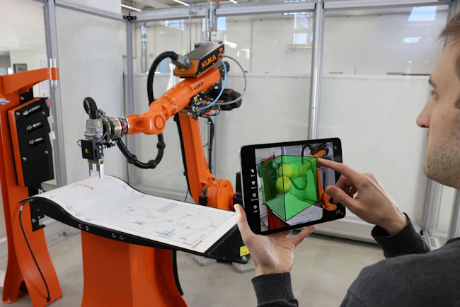 The Kuka.MixedReality app uses augmented reality to make robot setup easy.