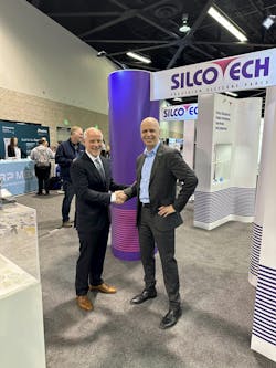Silcotech President Michael Maloney, left, and Arburg President Martin Baumann, right, shake hands at Silcotech's booth. Silcotech President Michael Maloney, left, and Arburg President Martin Baumann, right, shake hands at Silcotech's booth.